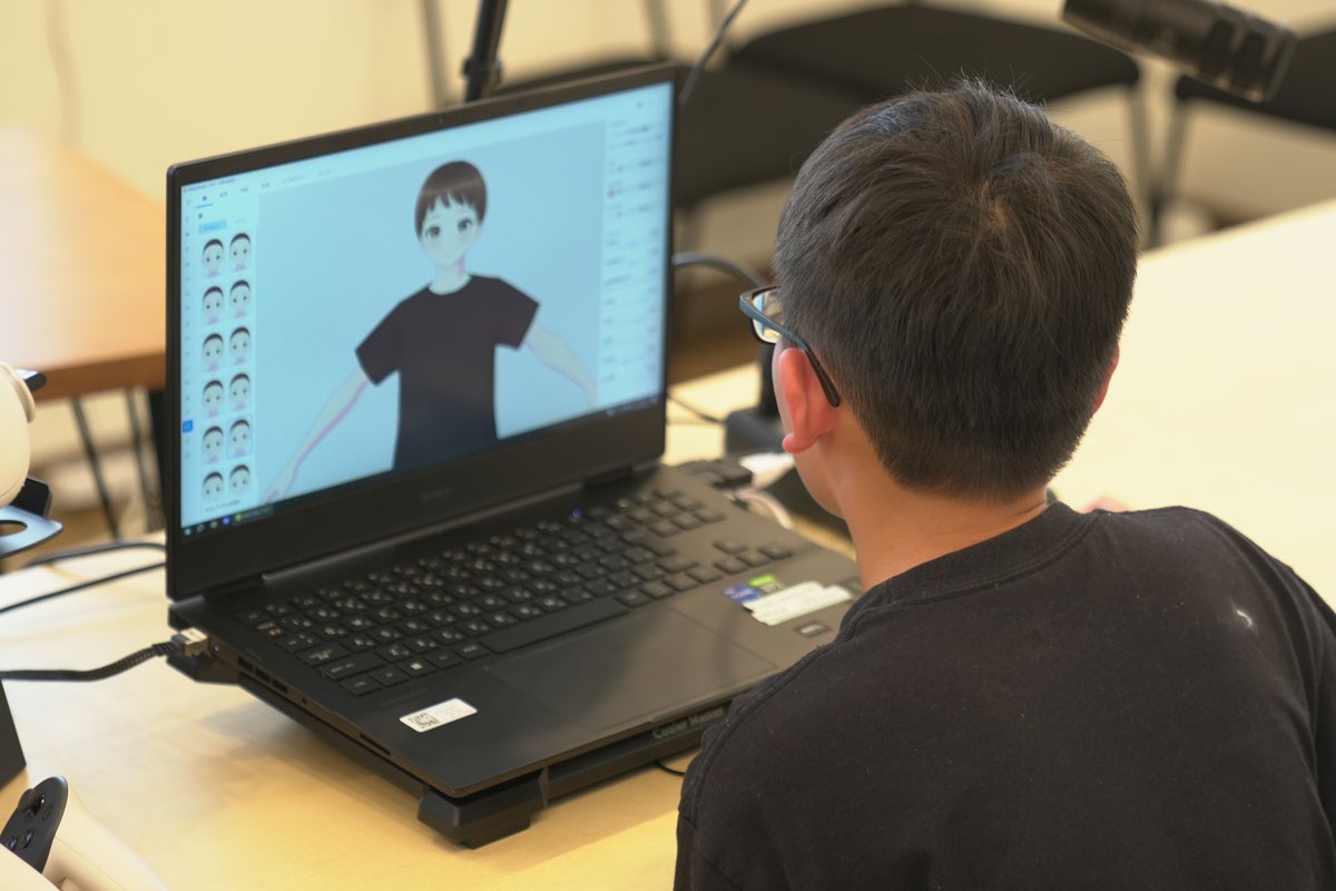 A participant creating a 3D avatar in VRoid Studio at a past event